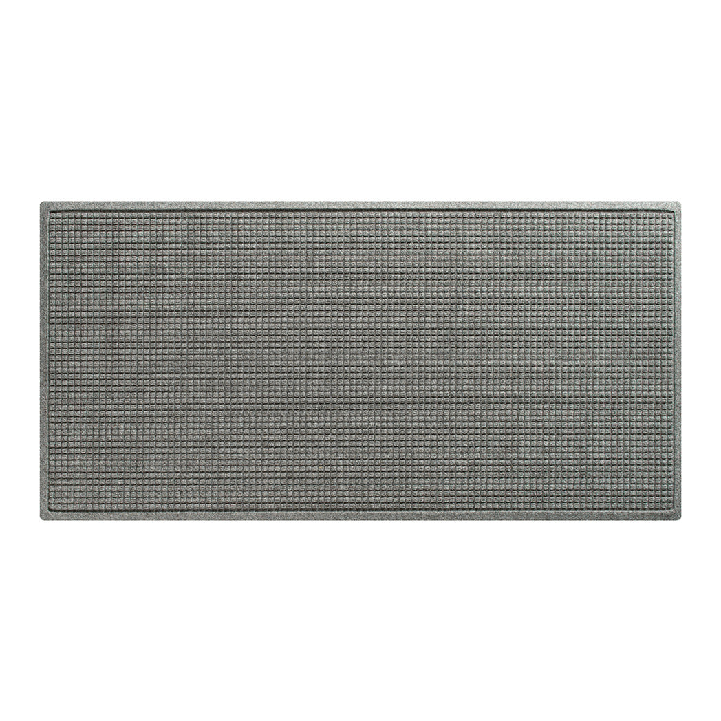 A WaterHog Squares runner made with an eco-friendly surface and backed by durable rubber, shown in light grey.