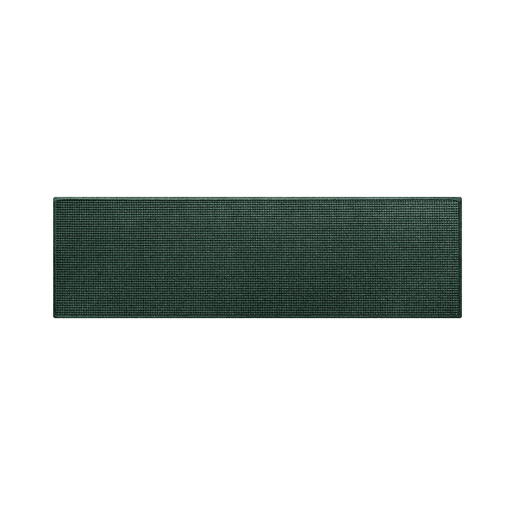 A larger sized genuine WaterHog outdoor runner mat with a deep green durable eco-friendly surface that helps protect your floors.