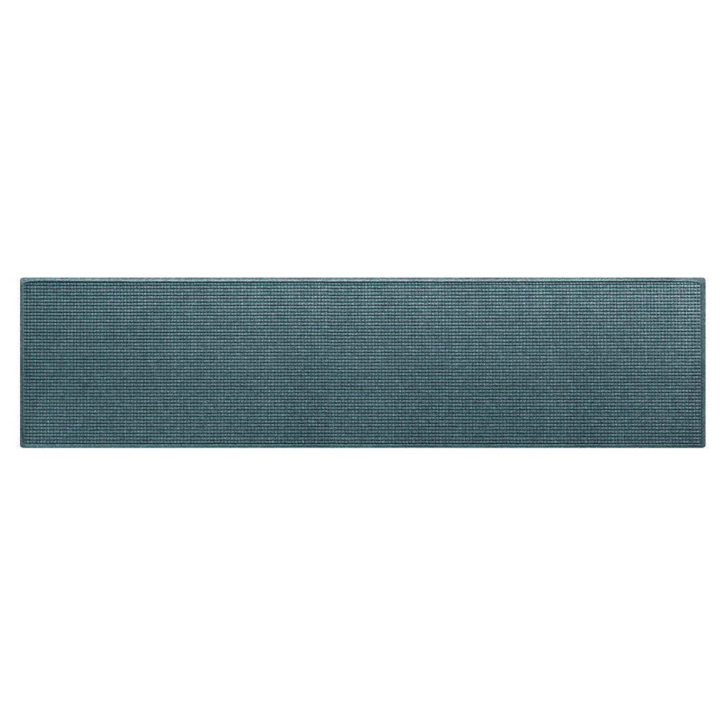 Extra long WaterHog Luxe runner mat in unique beautiful color consisting of blue, grey, and green.