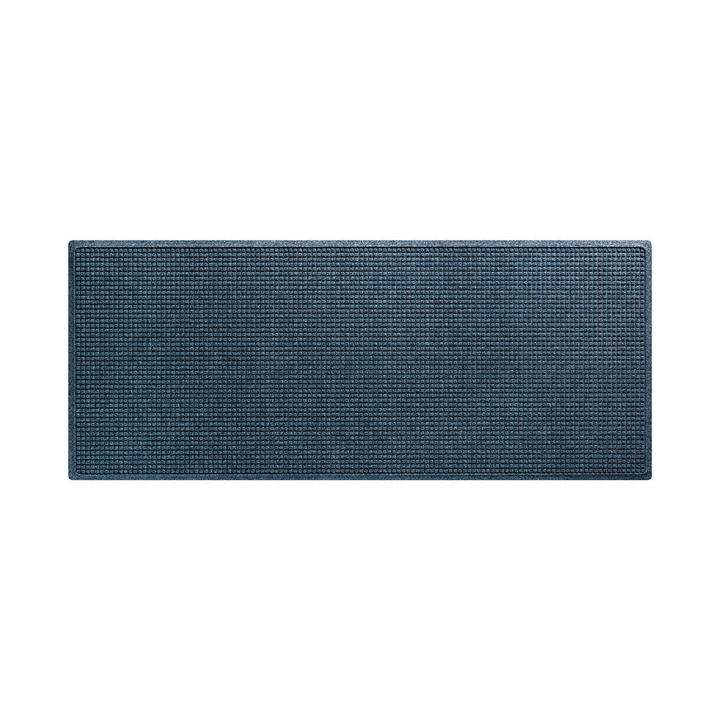 A medium Squares WaterHog indoor/outdoor runner mat with a relaxed blue, uniform grid design; Made in America with recycled materials.