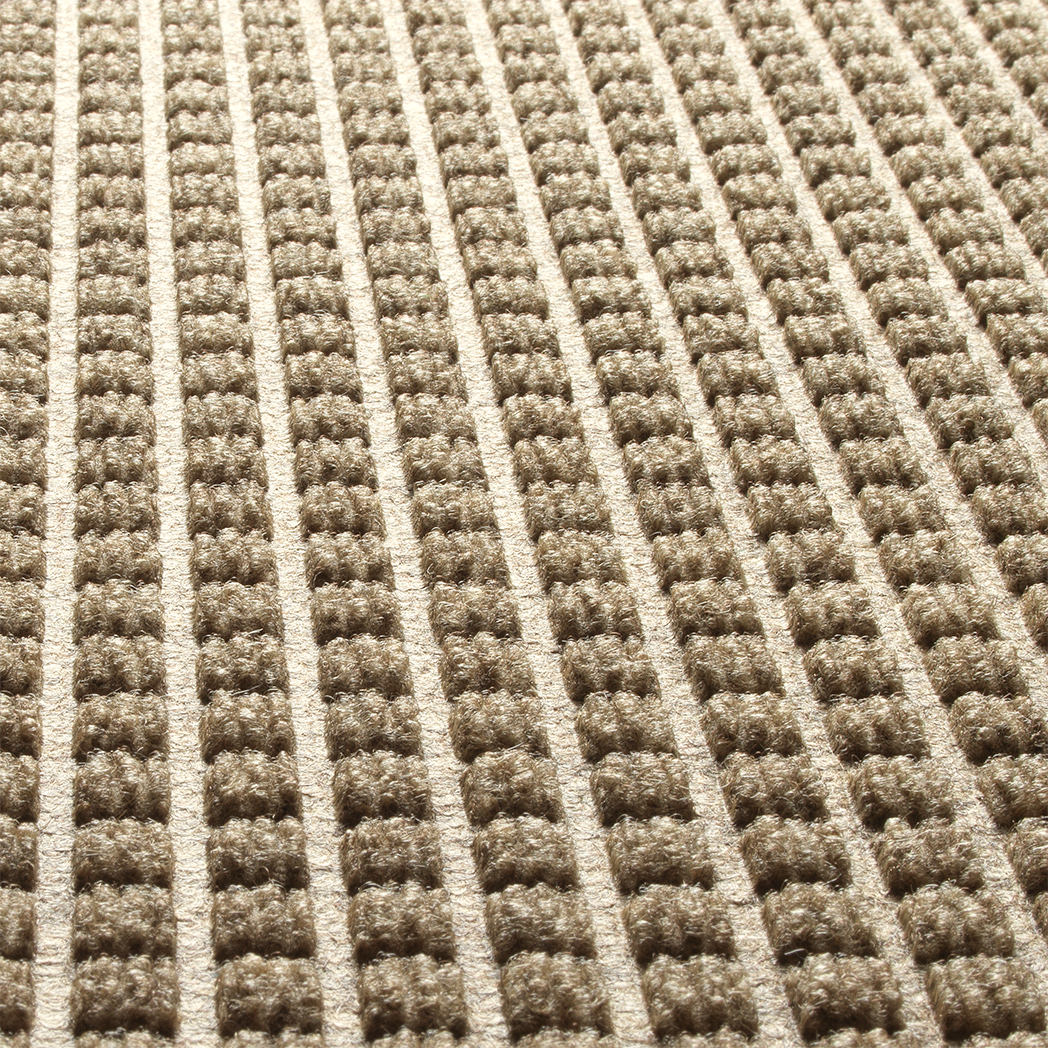 Close-up detailed image of WaterHog Squares bi-level surface made of light tan recycled PET for a fade and stain-resistant mat.