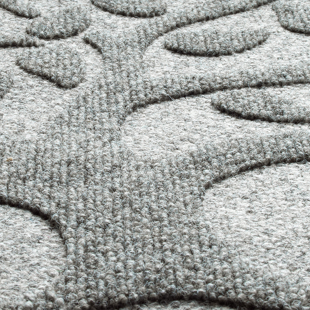 Detailed shot of the Tree of Life's surface, showing the eco-friendly surface fibers made of whites, greys, and even some blacks to accomplish the soft, medium grey color.