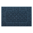 An overhead view of a medium, navy Tristan all-weather doormat, which features an ornate scrollwork pattern that borders the classic, squared-off diamonds pattern in the center; all in the a bi-level design and with a water dam border.