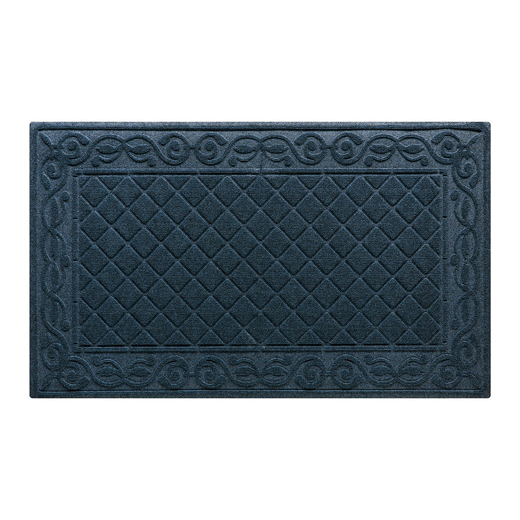 A large WaterHog Tristan doormat in navy with a two-part design - an ornate scroll pattern boarding the classic diamonds pattern - all backed by durable rubber backing.