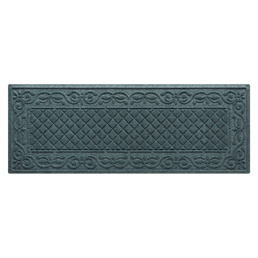 A WaterHog runner in the Tristan all-weather mat design shown in a deep navy color with a two-part design - an ornate scroll pattern boarding the classic diamonds pattern.