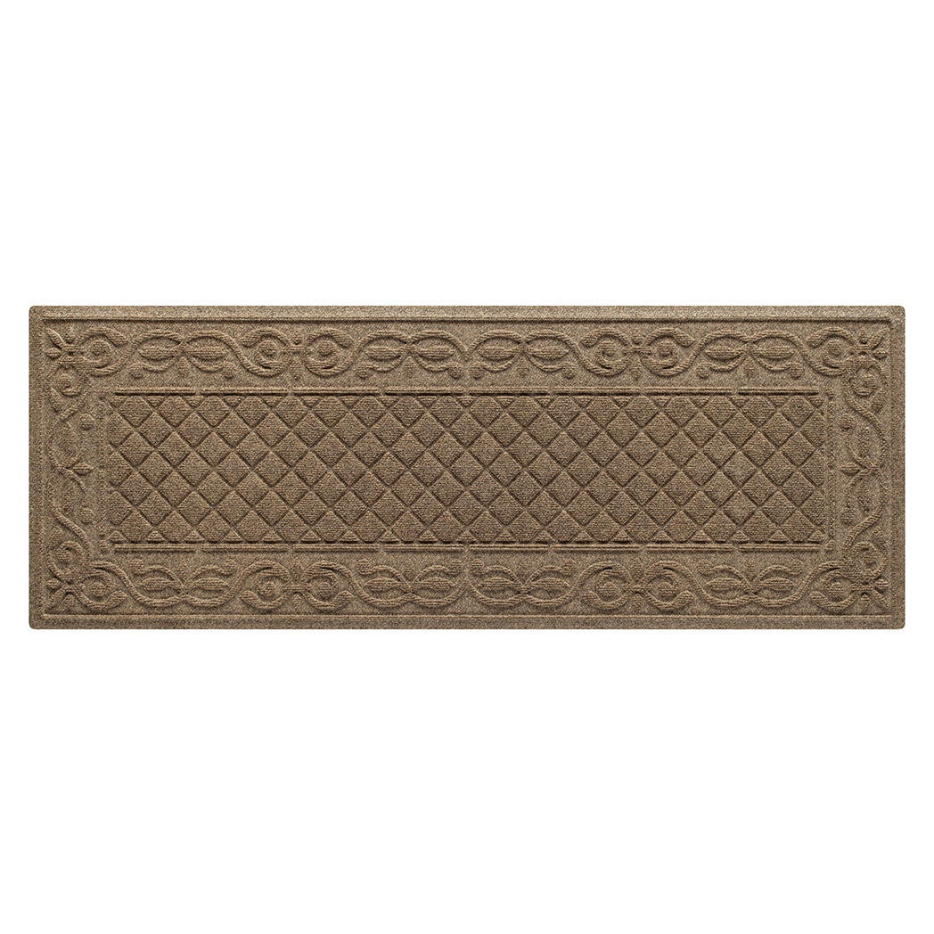 An overhead of a tan WaterHog Tristan all-weather runner in a two-part design - an ornate scroll pattern boarding the classic diamonds pattern, shown on a white background.
