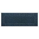 A WaterHog Tristan Runner door mat in a deep navy color with a two-part design - an ornate scroll pattern boarding the classic diamonds pattern - all backed by durable rubber backing.