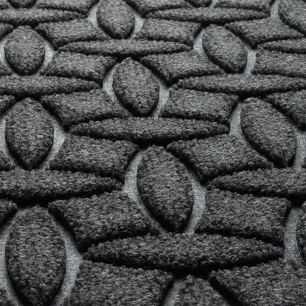 Close-up of WaterHog's Ellipse the eco-friendly fibers made of various shades of grey to black, with hints of white fibers.