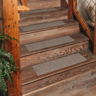 WaterHog outdoor Stair Treads placed on an outdoor or enclosed wooden staircase for protection from scuffing, added traction, and the help of preventing tracking of dirt and moisture.