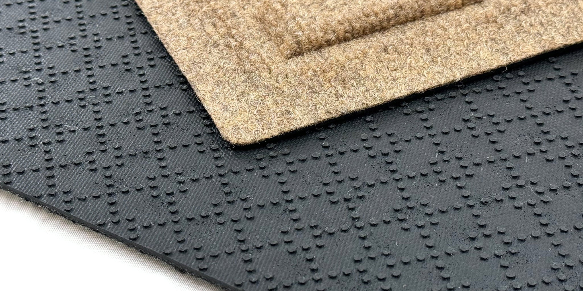 Close up image of WaterHog rubber cleated backing. 