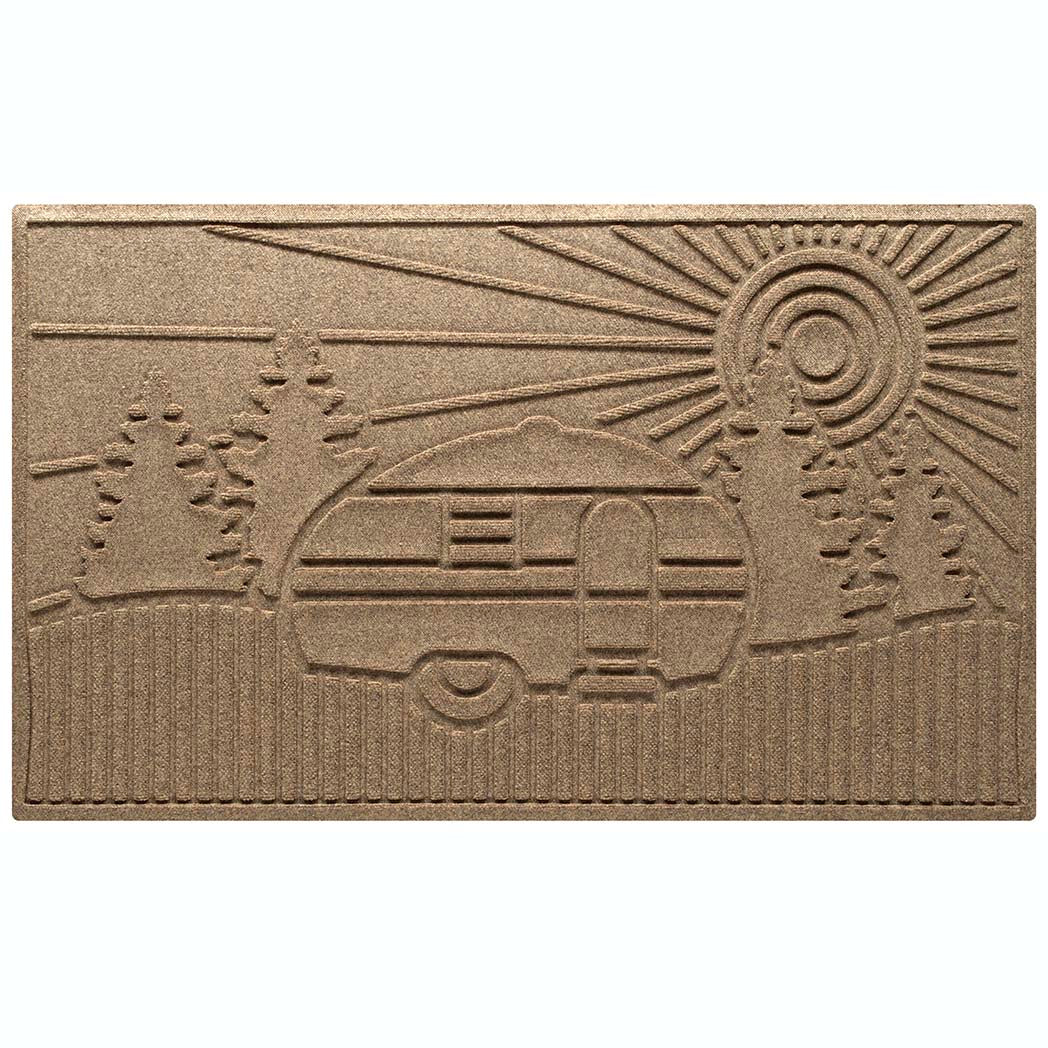 Outdoor WaterHog RV Large Door mat in tan with a design of an RV at a campsite with fir trees and a sunset.