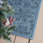 Snowflake designed doormat on an eco-friendly, fast-drying surface on a wooden deck with durable rubber backing