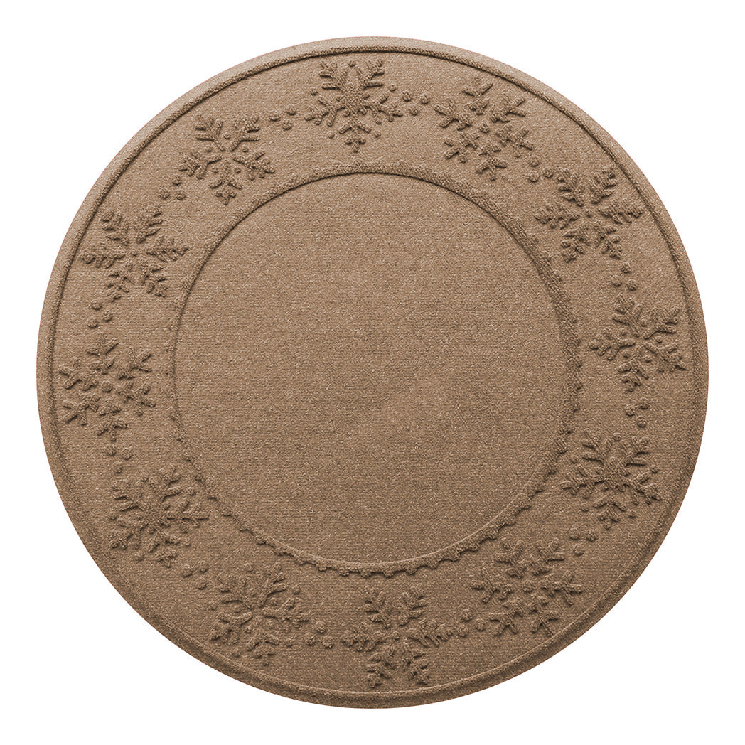 Round tan WaterHog Tree Skirt with snowflake patterns on an eco friendly surface on a white background