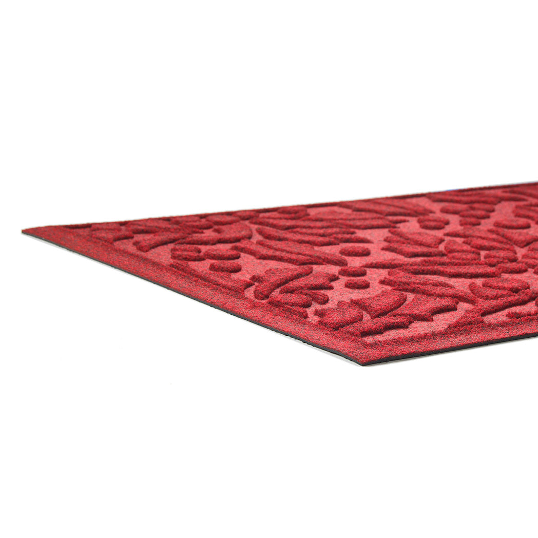 Red low-profile textured rug on a white background