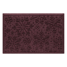 Deep red doormat with snowflake pattern on a white background