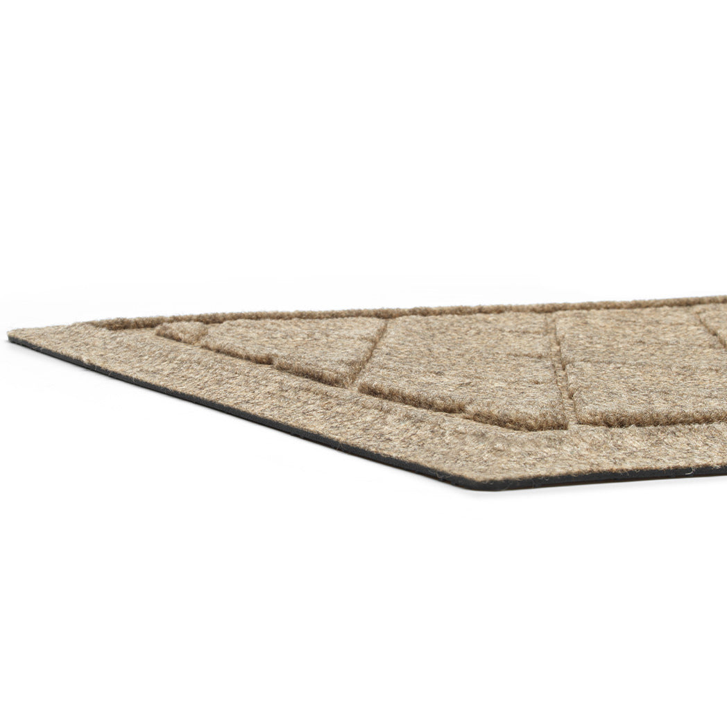 A close-up of Cordova's half-round doormat's low-profile height and bi-level design made for scraping off dirt and moisture.