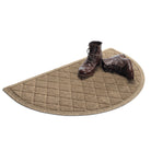 Isolated WaterHog Argyle half-round doormat in light tan with a pair of brown leather boots on the all-weather doormat.