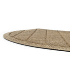 A close-up of Argyle's half-round doormat's low-profile and water damn border, made for containing rain water off your floor for protection from damage.