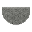 An overhead of a WaterHog Argyle half-round doormat with a light grey surface and interlocking diamond pattern for a timeless feel.