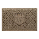 Isolated image of a medium outdoor WaterHog Bombay Monogrammed Doormat that features a classic repeating geometric pattern with an encircled letter placed in the center; shown in a light brown camel color.