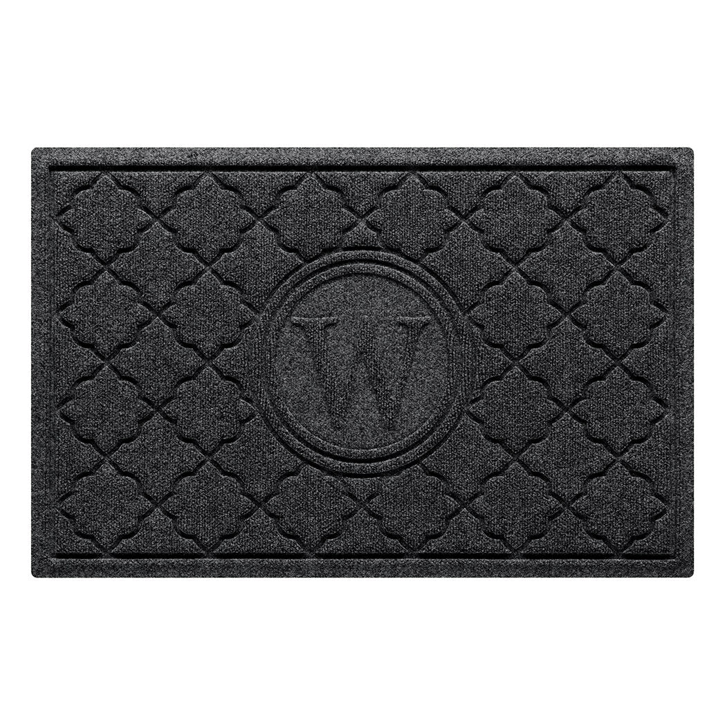 Isolated image of a medium size all-weather WaterHog Bombay Monogrammed Outdoor Doormat that features a classic repeating geometric pattern with an encircled letter placed in the center; shown in a dark charcoal color.