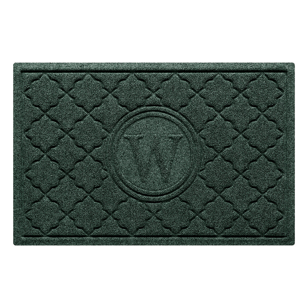 Isolated image of a medium size WaterHog Bombay Monogrammed Outdoor Doormat that features a classic repeating geometric pattern with an encircled letter placed in the center; shown in a dark evergreen color.