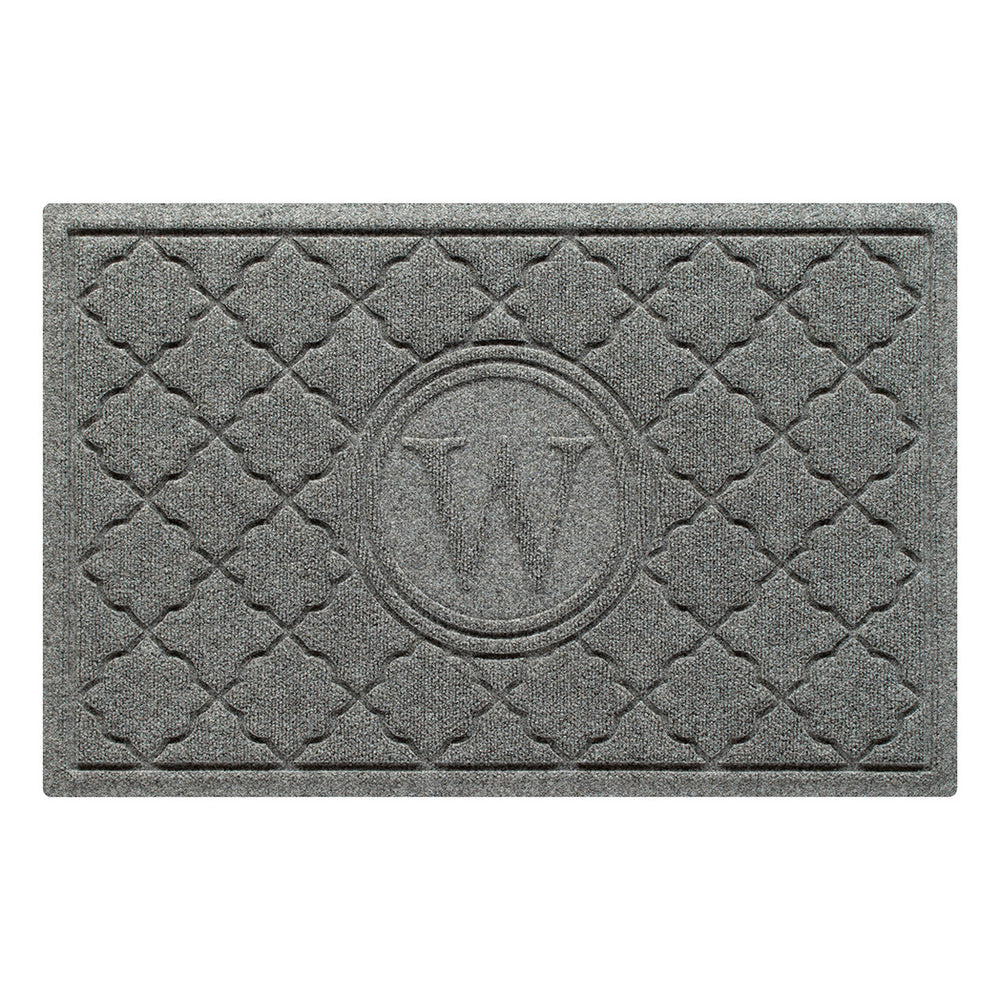 Isolated image of a WaterHog Bombay Monogrammed Outdoor Doormat that features a classic repeating geometric pattern with an encircled letter placed in the center; shown in a medium grey color.