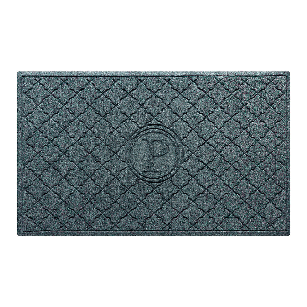 Isolated image of a large outdoor WaterHog Bombay Monogrammed Door mat that features a classic repeating geometric pattern with an encircled letter placed in the center; shown in a blue-grey color.