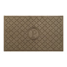 Isolated image of a large outdoor WaterHog Bombay Monogrammed Doormat that features a classic repeating geometric pattern with an encircled letter placed in the center; shown in a light brown camel color.