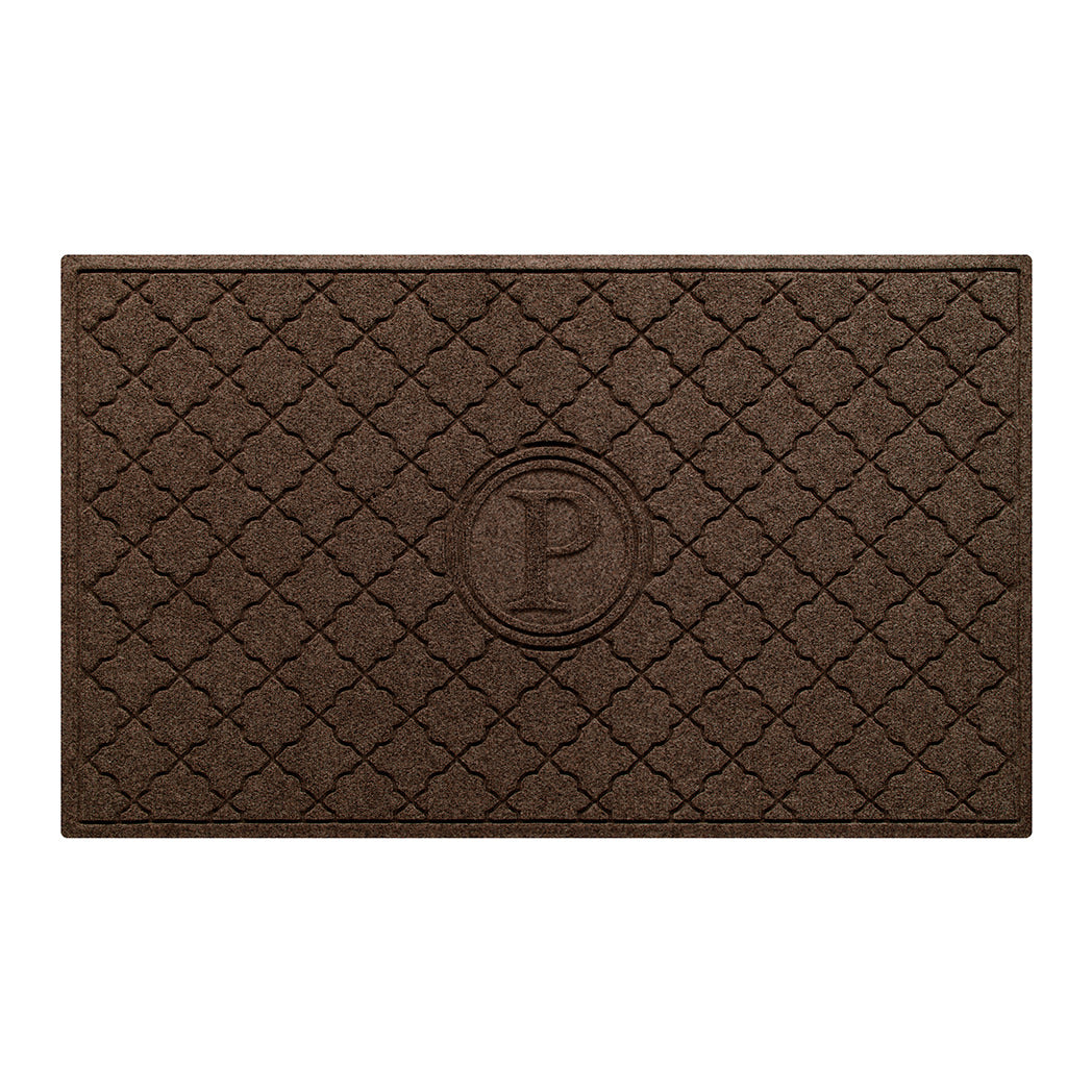 Isolated image of a large all-weather WaterHog Bombay Monogrammed Outdoor Doormat that features a classic repeating geometric pattern with an encircled letter placed in the center; shown in a dark brown color.