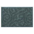 Overhead of a WaterHog medium indoor/outdoor doormat in a light blue/green curling botanical design, all backed by durable rubber backing.