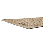 A low and close shot of a Boxwood's medium doormat's low-profile edge, bi-level surface, perfect for trapping dirt and moisture below shoe level to prevent tracking.