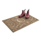 Angled WaterHog 2x3 Boxwood doormat monogrammed with an s with a pair of pink rubber boots in the doormat.