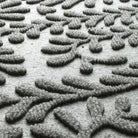 Blown-up view of the fade-resistant WaterHog surface creating a light grey, durable long-lasting doormat.