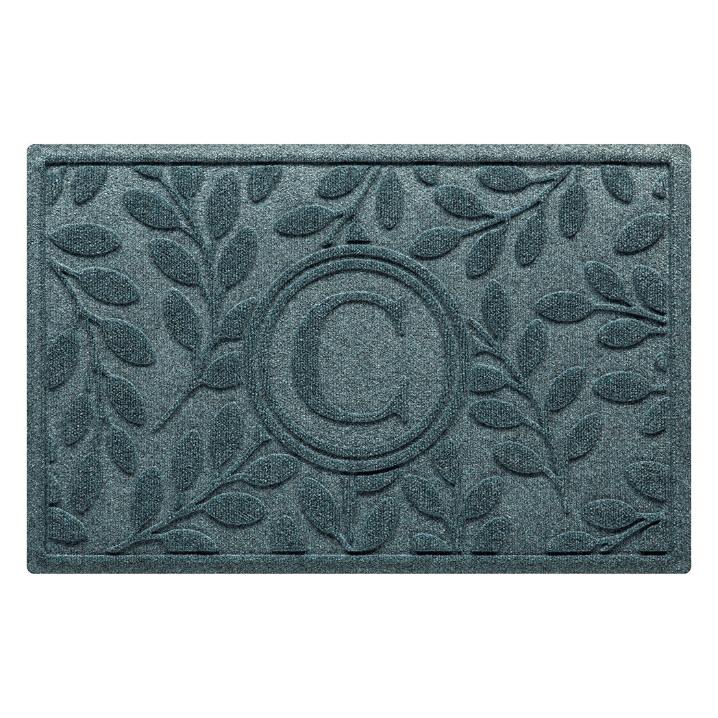 Monogrammed WaterHog indoor/outdoor all-weather doormat with beautiful botanical design surrounding the centered monogram in a blue/green/grey color. 