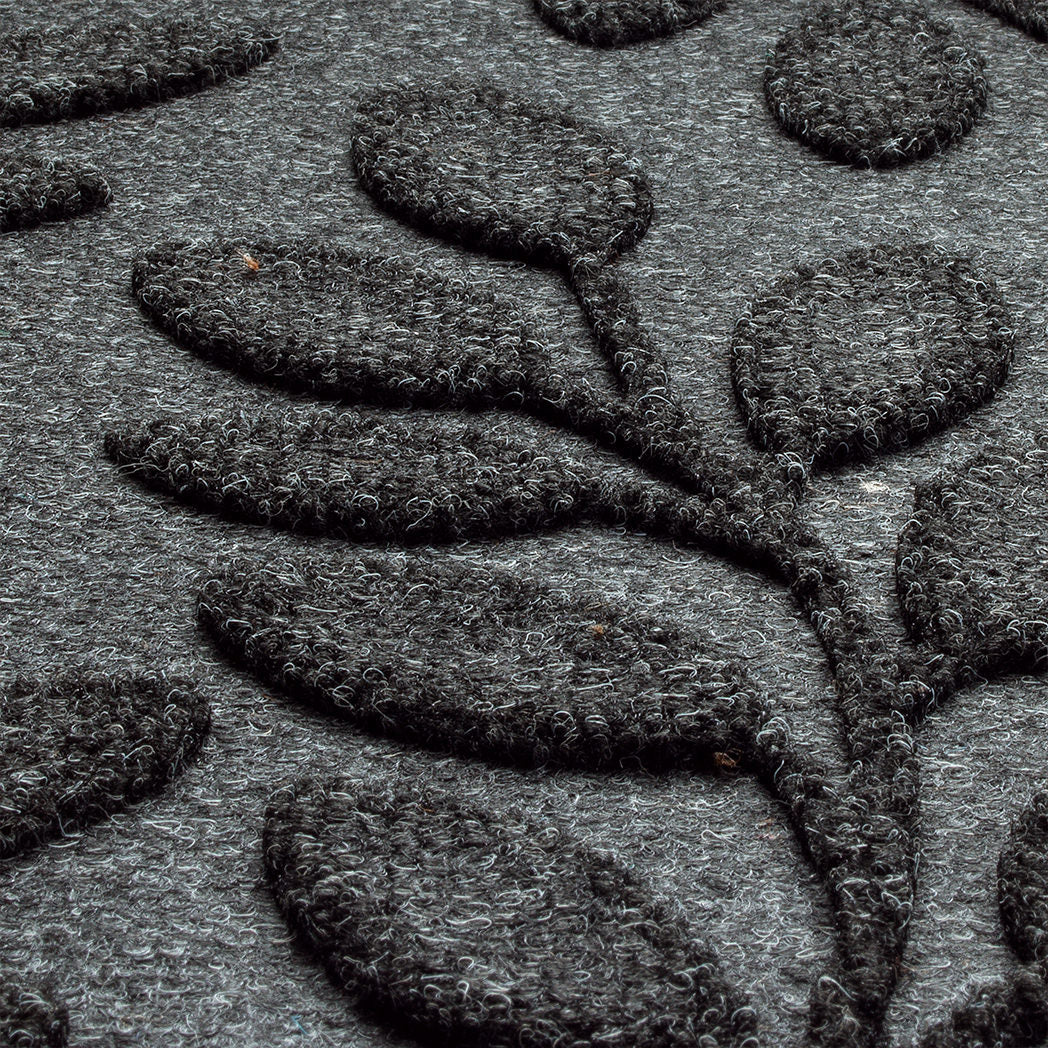 zoomed in photo of genuine WaterHog doormat with botanical bi-level leaves detailing the PET fibers in black and gray creating a deep/grey charcoal. 