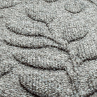 Close-up of light grey PET fiber surface of a genuine WaterHog doormat. Bi-level design perfect for trapping dirt and debris. 