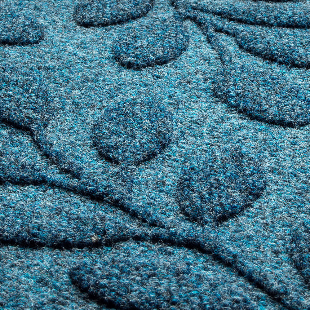 Zoomed in photo of surface of WaterHog Brittney leaf doormat made with recycled PET fibers in black, blue, and grey.