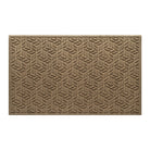 An OG WaterHog large indoor/outdoor doormat in a light tan leaf petal design, and eco-friendly, durable surface.