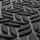 Blown-up view of the eco-friendly WaterHog surface fibers made of various shades of grey to black, with hints of white fibers.