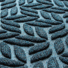 Close-up of the all-weather WaterHog durable surface fibers made of dark and light blues, white and grey strands.