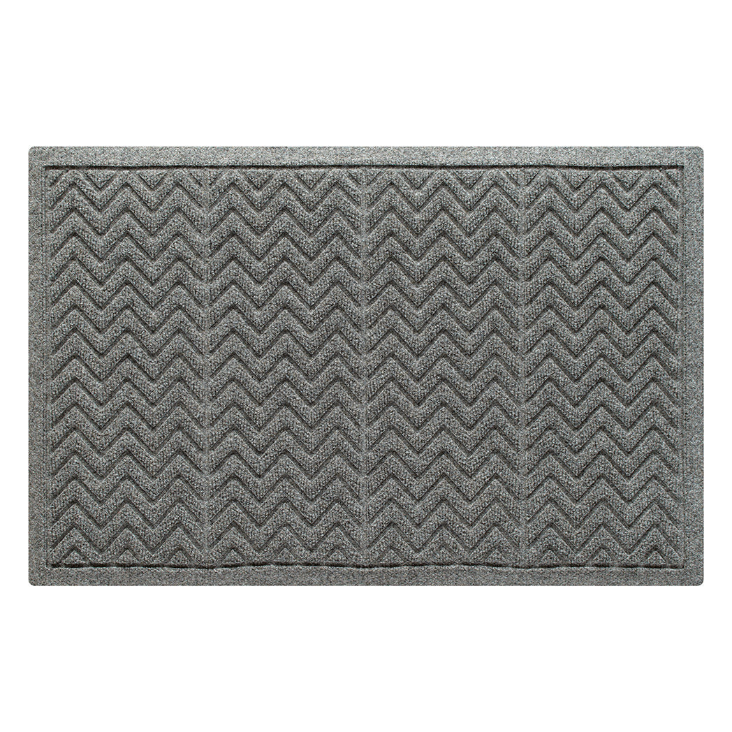 Standard WaterHog doormat in a medium grey color with a textured zigzag pattern made from recycled materials and designed to trap dirt and moisture. Made in the USA. 