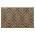 Overhead of a medium Cordova WaterHog indoor/outdoor doormat in a light tan color and repeating quatrefoil, bi-level design.