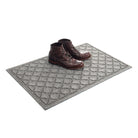 Angled 2x3 WaterHog Cordova doormat in medium grey with a pair of brown leather boots placed on top.