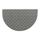 Overhead of a WaterHog Cordova doormat in a light grey surface and repeating quatrefoil pattern.