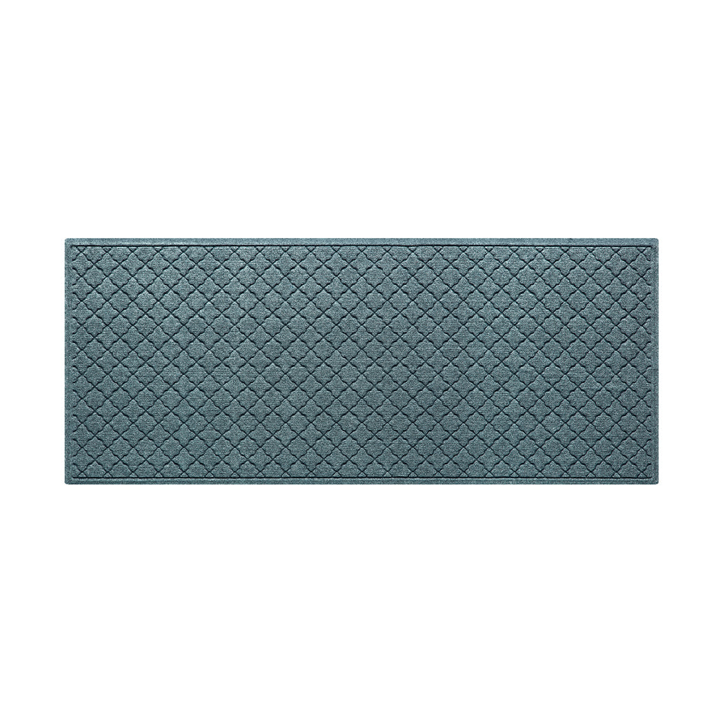 A premium WaterHog 3x7 runner mat in a light blue/grey repeating quatrefoil pattern.