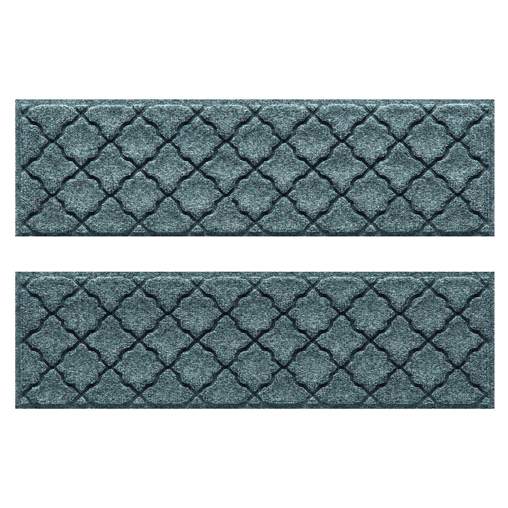 Pair of WaterHog Cordova fade-resistant stair treads  in a light blue/grey repeating quatrefoil, bi-level design.