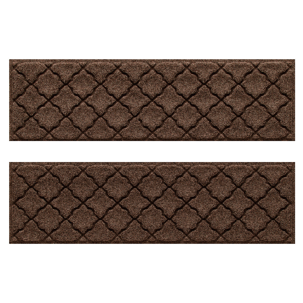 WaterHog indoor/outdoor stair treads in a dark earthy brown surface and repeating quatrefoil pattern.