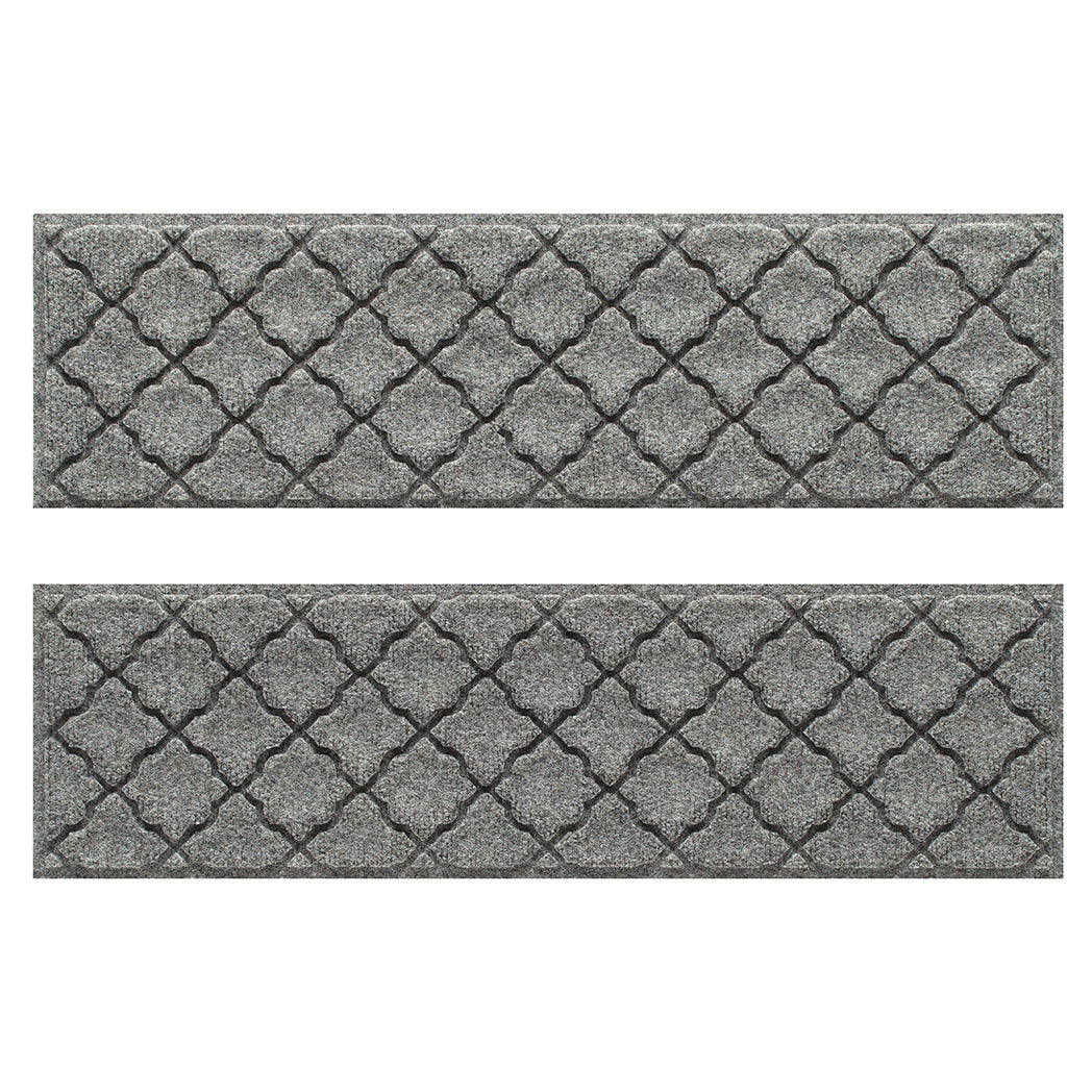 WaterHog indoor/outdoor luxury stair treads in a light grey surface and repeating quatrefoil pattern.