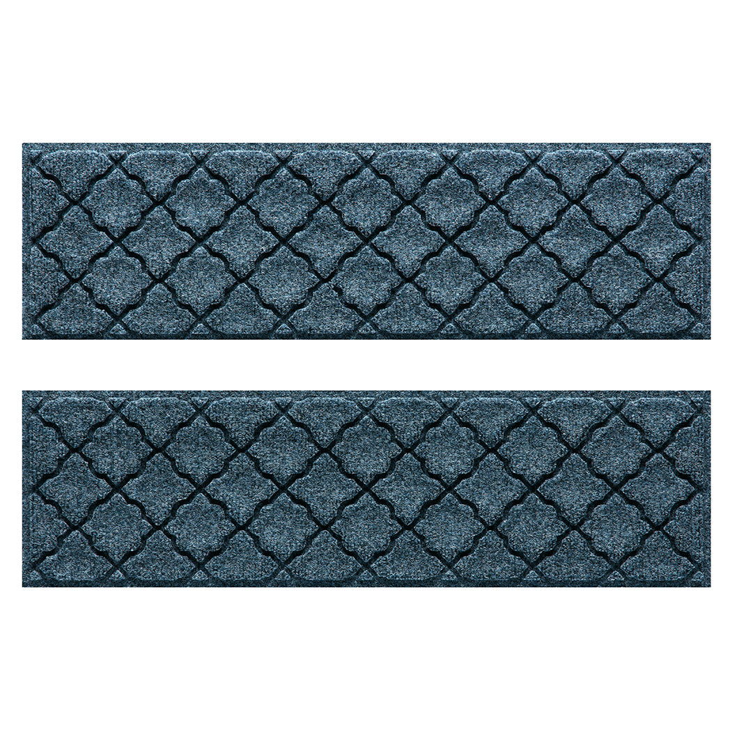 Quality WaterHog outdoor stair treads with a relaxed blue surface and repeating quatrefoil pattern.